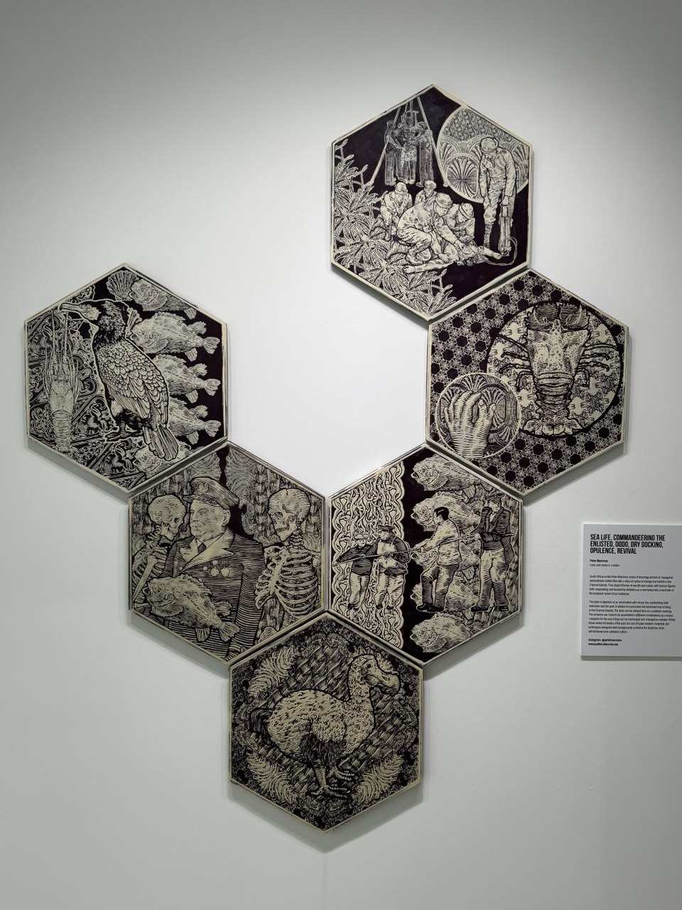 Six hexagonal relief works by Peter Mammes installed together on a white gallery wall.